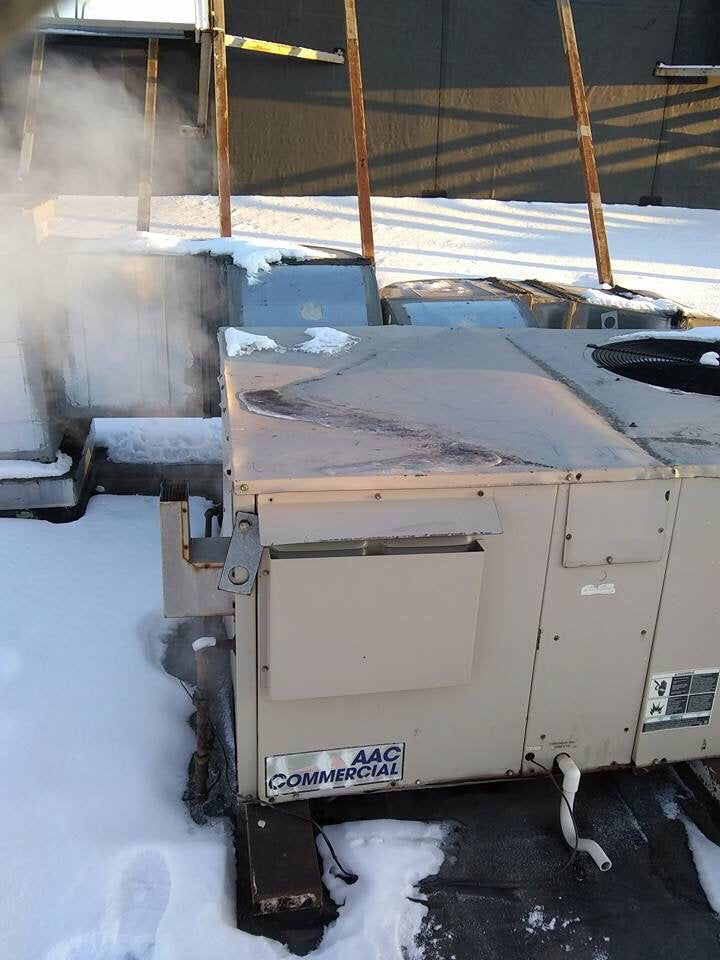 Commercial rooftop HVAC unit operating reliably in winter conditions to ensure consistent heating performance.